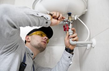 worker-repairing-water-heater (1)-min